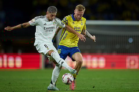 La liga 2024-25: Real Madrid's Federico Valverde, left, and Las Palmas' Oliver McBurnie fight for the ball
